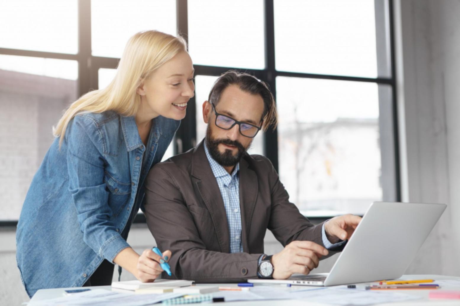 Financial professionals reviewing analysis reports and data visualizations